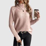 "Nora – Klasický svetr s vysokým límcem" could be rewritten as "Nora – Elegantní svetr s vysokým límcem".