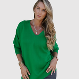 "Nora – Elegantní svetr s V-výstřihem" can be rewritten as "Nora – Stylový svetr s V-výstřihem".