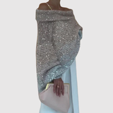 "Nora – Lesklý svetr s odhaleným ramenem" could be rewritten as "Nora – Lesklý svetr s jedním odhaleným ramenem".