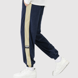 Denis – Sportovní kalhoty s kontrastními pruhy" can be rewritten as:

"Denis – Sportovní kalhoty s výraznými kontrastními pruhy