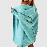 "Jelena – Dlouhý kardigan s kapucí" can be rewritten as "Jelena – Dlouhý kardigan s kapucí pro pohodlný styl".