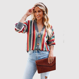 "Nora – Barevný pletený kardigan s knoflíky" could be rewritten as "Nora – Pestrý pletený kardigan s knoflíky".