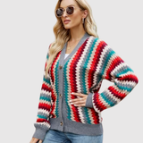 "Nora – Barevný pletený kardigan s knoflíky" could be rewritten as "Nora – Pestrý pletený kardigan s knoflíky".