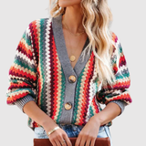 "Nora – Barevný pletený kardigan s knoflíky" could be rewritten as "Nora – Pestrý pletený kardigan s knoflíky".