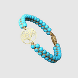 Liana – Náramek s tyrkysovými korálky a zlatým talismanem ve tvaru „Stromu života“