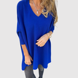 "Nora – Elegantní svetr s V-výstřihem" can be rewritten as "Nora – Stylový svetr s V-výstřihem".