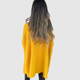 "Nora – Elegantní svetr s V-výstřihem" can be rewritten as "Nora – Stylový svetr s V-výstřihem".