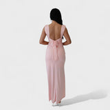 Sarella - Dlouhé šaty s odhalenými zády a mašlí" can be rewritten as:

"Sarella - Elegantní dlouhé šaty s odhalenými zády a stylovou mašlí