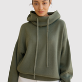 "Nora - Teplý pletený svetr s kapucí" could be rewritten as "Nora - Hřejivý pletený svetr s kapucí".