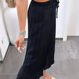 Maya | Černé plisované kalhoty – Pohodlný a elegantní střih