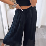 Maya | Černé plisované kalhoty – Pohodlný a elegantní střih