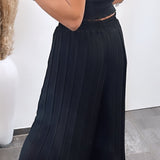 Maya | Černé plisované kalhoty – Pohodlný a elegantní střih