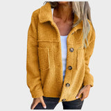 "Eva - měkká fleecová bunda s knoflíky" can be rewritten as "Eva - měkká fleecová bunda s dekorativními knoflíky".