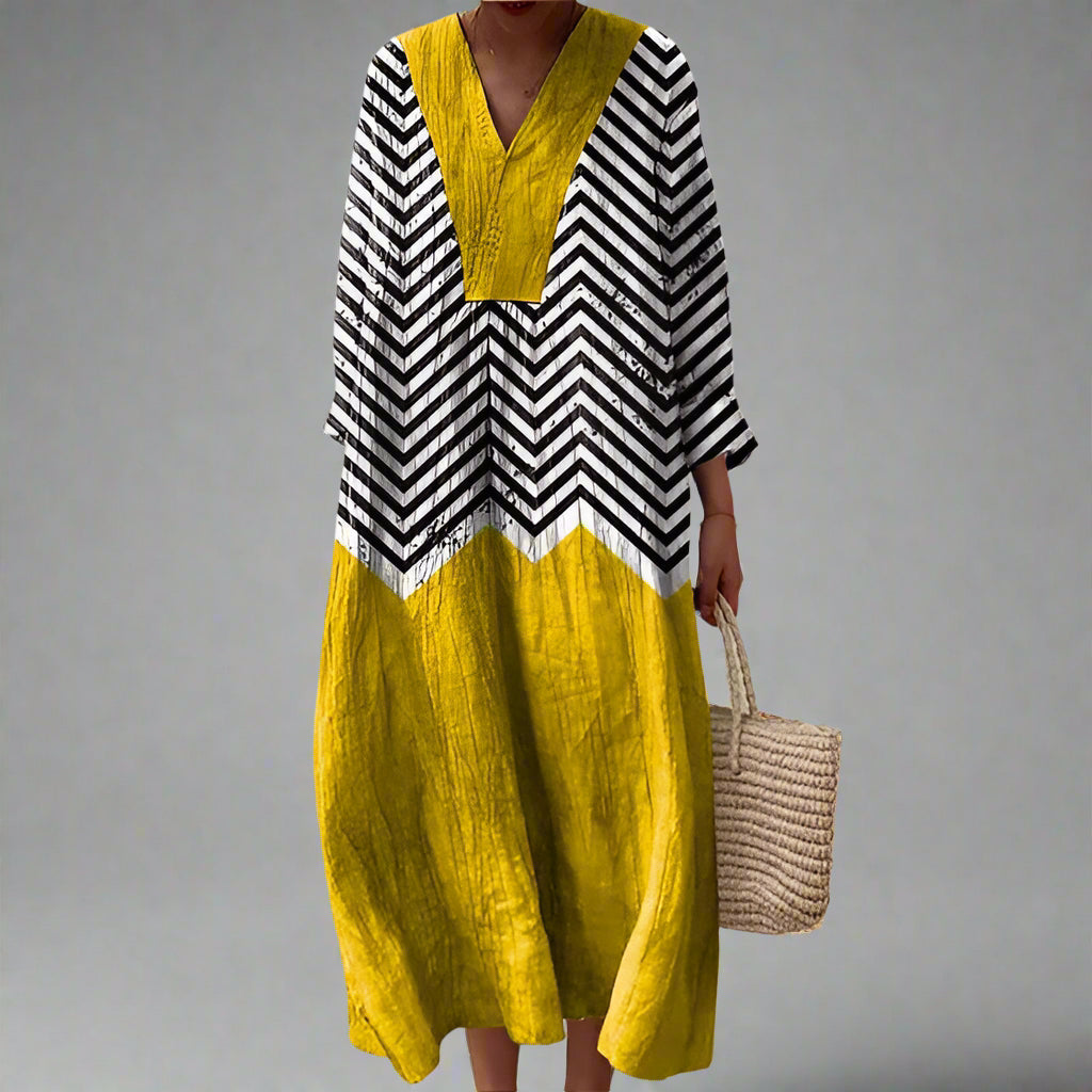 "Carla | Elegantní geometrické šaty" can be rewritten as "Carla | Stylové geometrické šaty s elegancí".