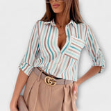 "Romina | Klasická blůza s límečkem" can be rewritten as "Romina | Elegantní blůza s límečkem".